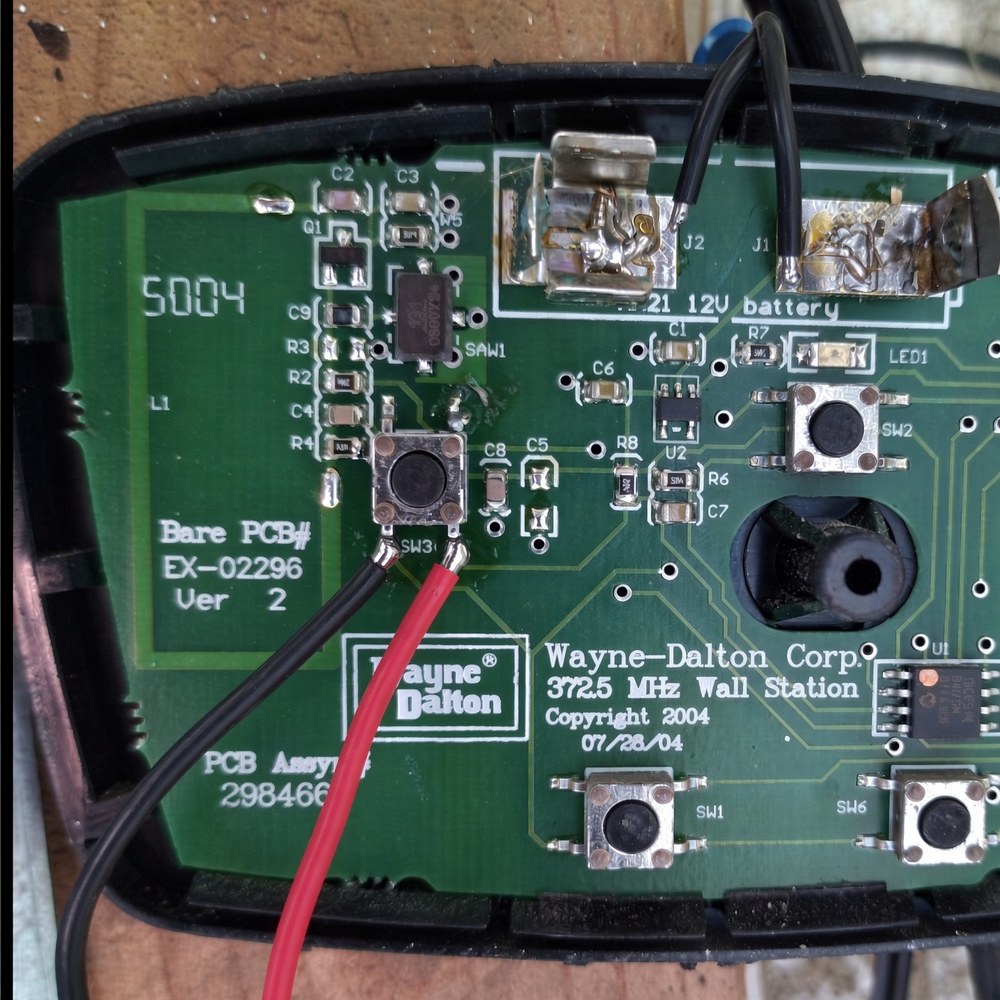 Wall switch with case removed, wires soldered to the target switch